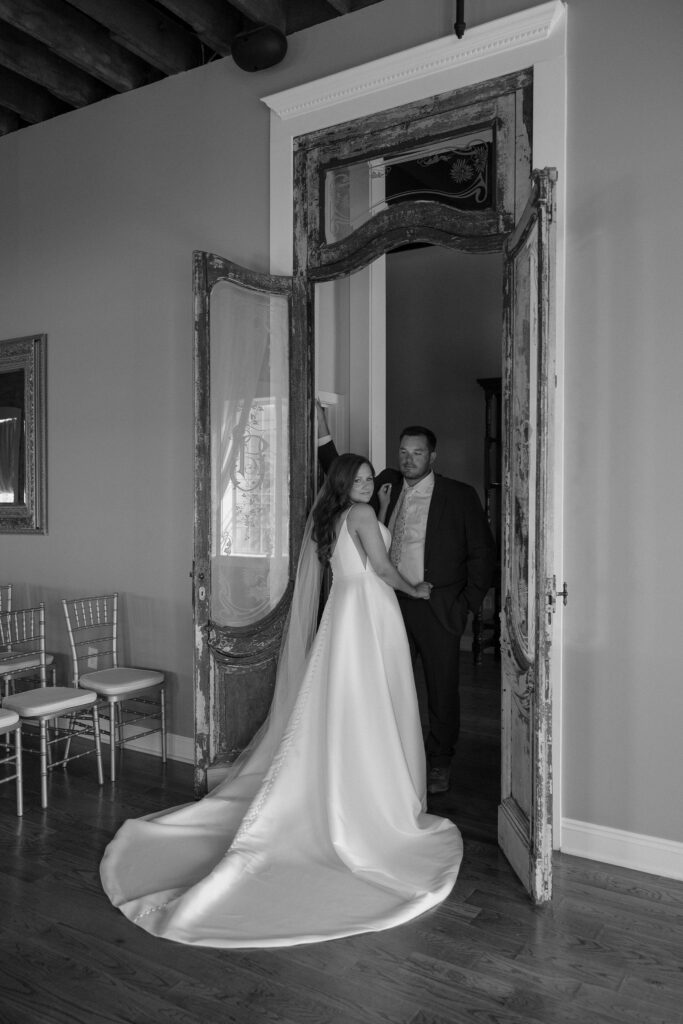 indoor bride and groom portraits with intentional wedding details