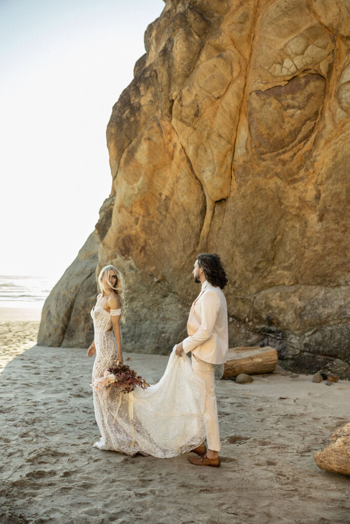 couple posing for beach elopement pictures