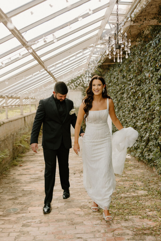 bride and groom walking and smiling