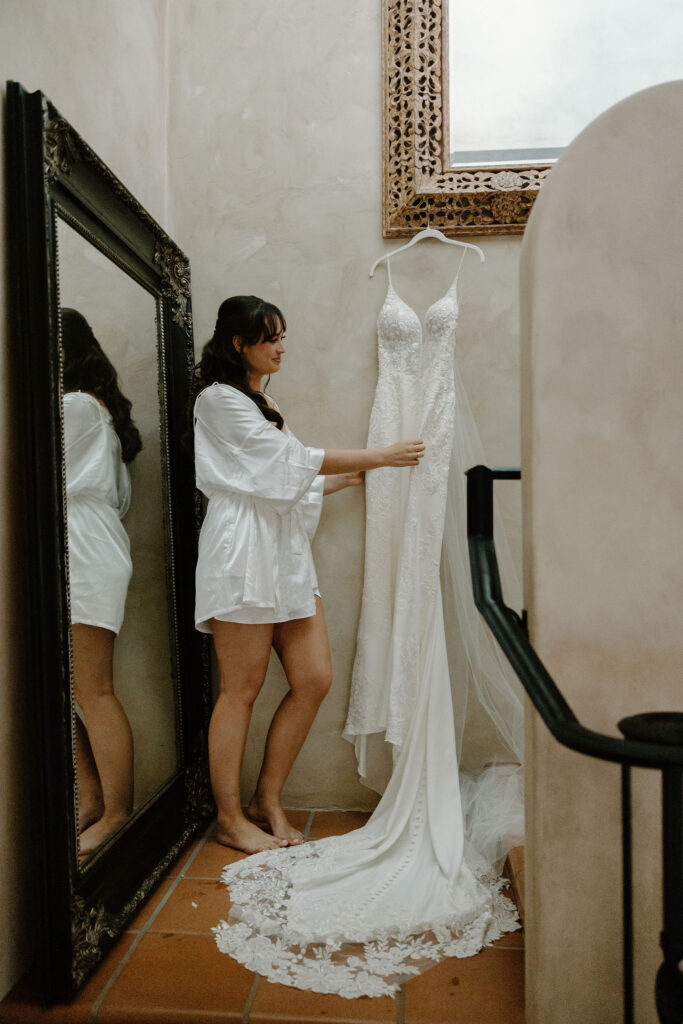 bride getting ready photos with wedding dress