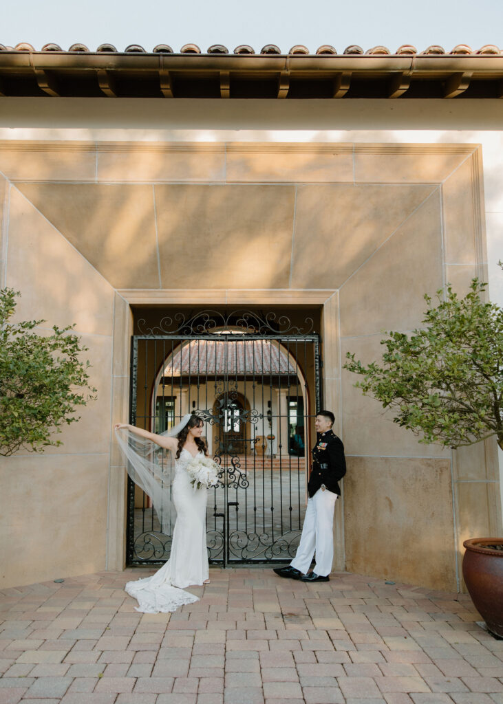 bride and groom portraits in front of venue