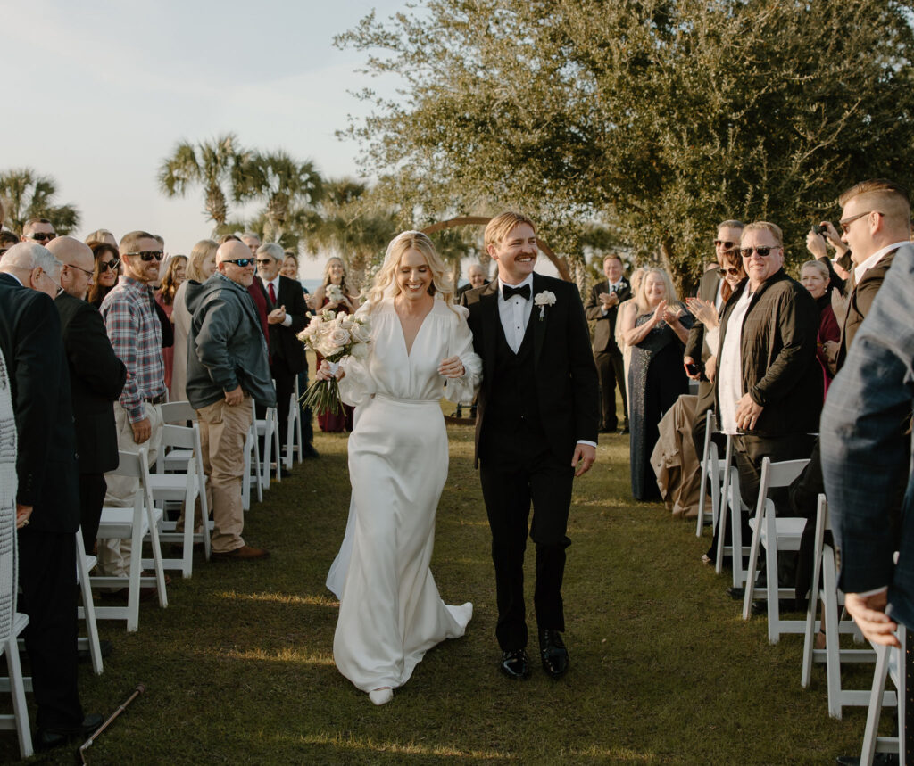 outdoor wedding ceremony at the view at st. joe bay in florida bride and groom