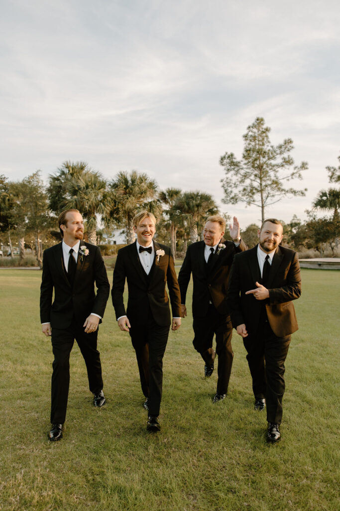 outdoor groomsmen portraits at the view at st. joe bay wedding venue in florida