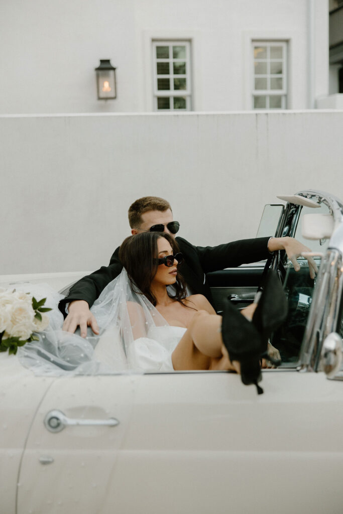 bride and groom in vintage car for elopement in florida