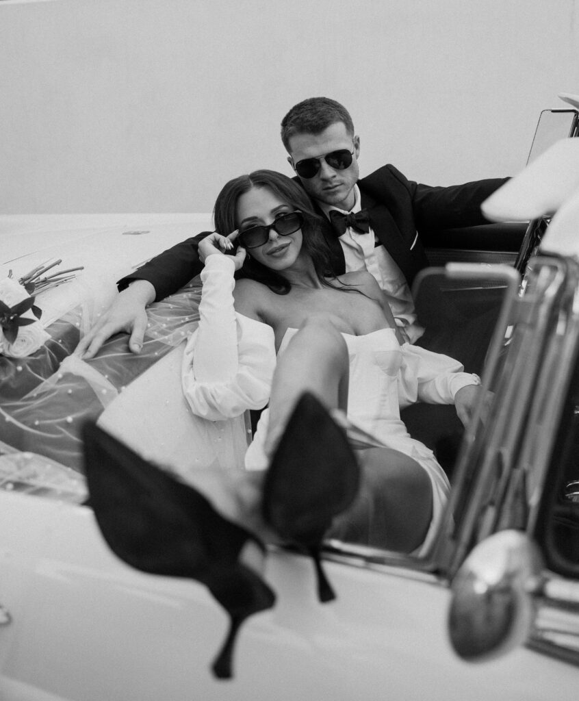 editorial bridals with sunglasses inside vintage car