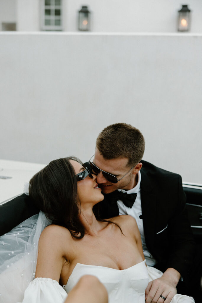 editorial bridals with sunglasses inside vintage car