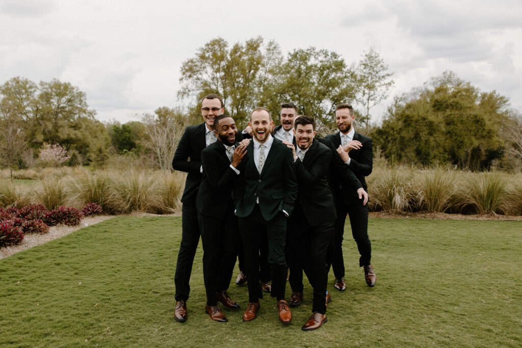 groomsmen candid photos with groom wedding party photos