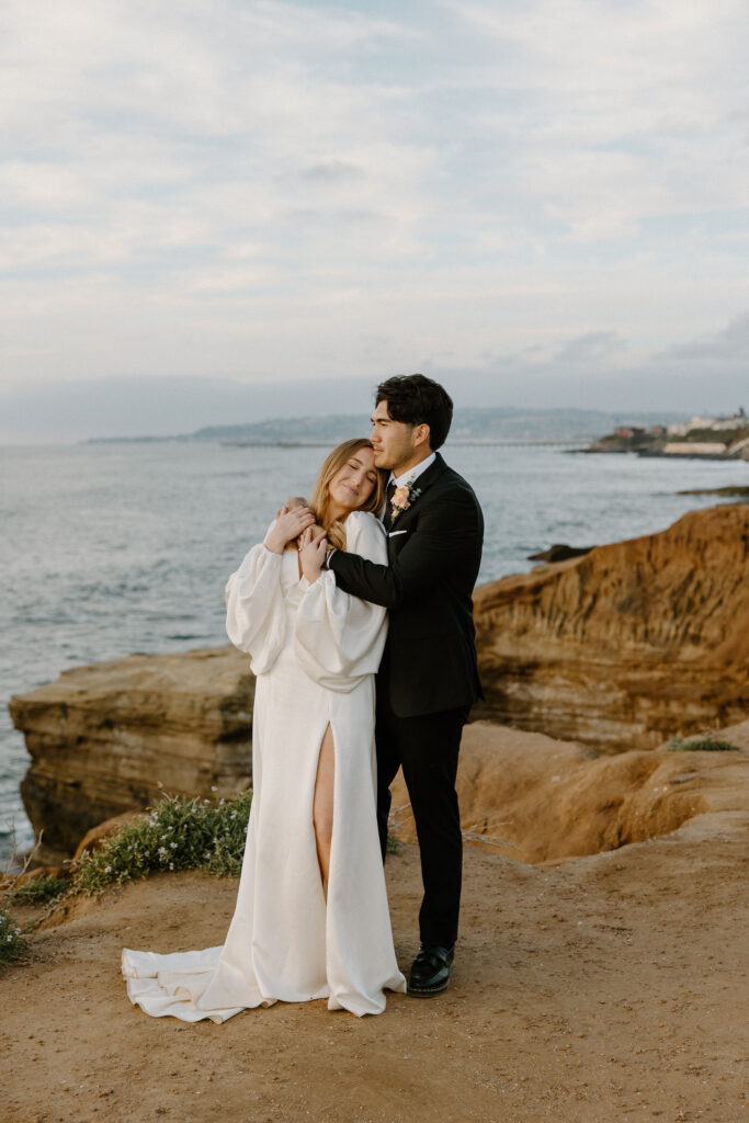bride and groom portraits on the sunset cliffs in san diego