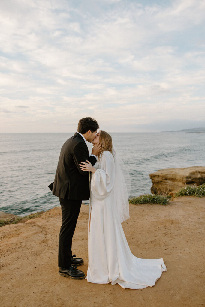 bride and groom portraits on the sunset cliffs in san diego