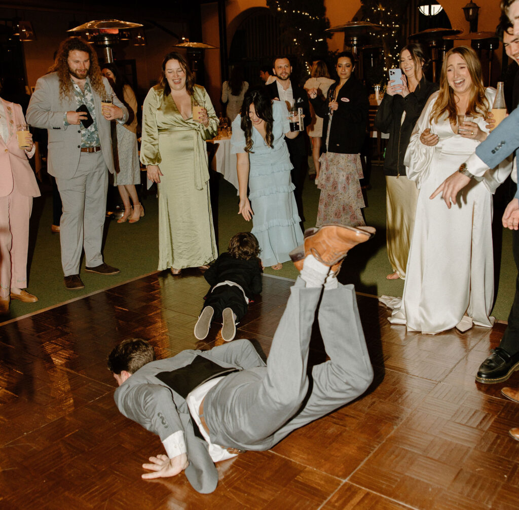 wedding guests dancing at wedding reception flash photography 