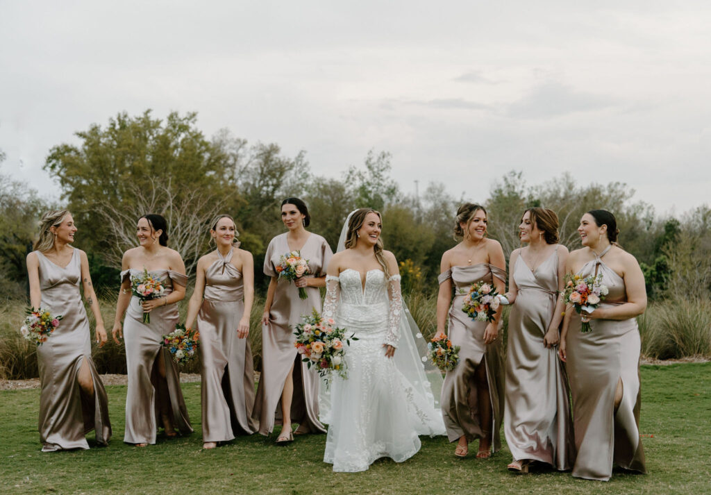 bridesmaids smiling at bride champagne silk bridesmaid dresses